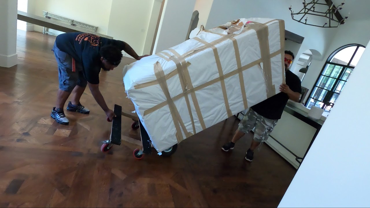 Moving a Stainless Refrigerator Upstairs in Lewisville TX by Rescue Moving Services