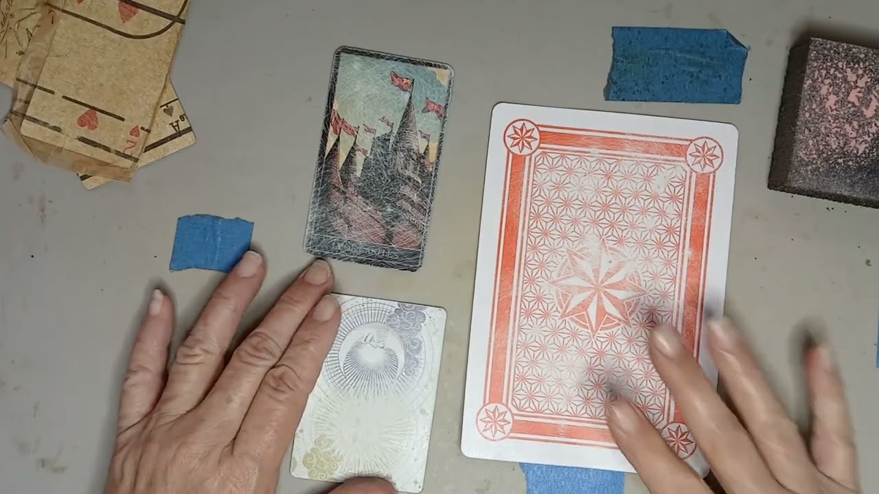 Preparing and covering old playing cards for junk journal additions.