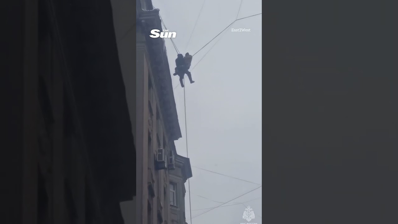 Russian janitor hangs in midair after falling off roof
