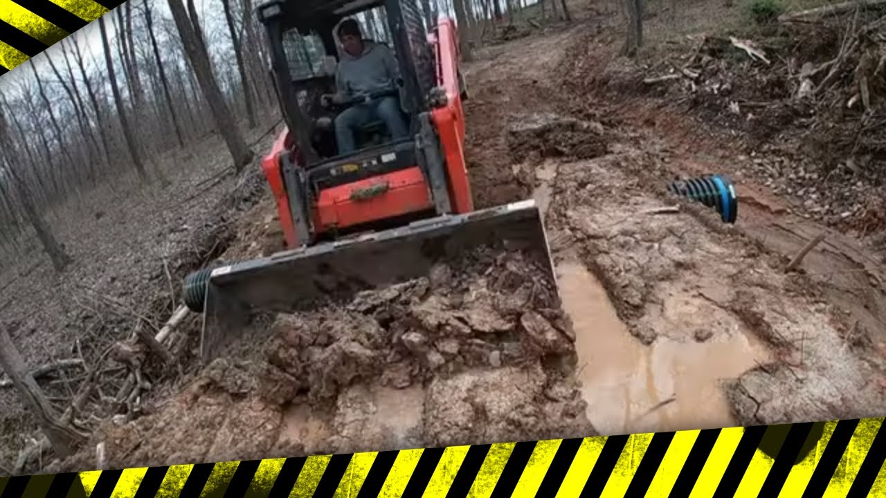 Homeowner rents Kubota Skidsteer to work on a forest road