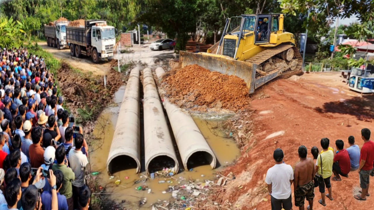 Successful PROJECT! Delete drainage by dump truck unloading soil and skill bulldozer pushing soil