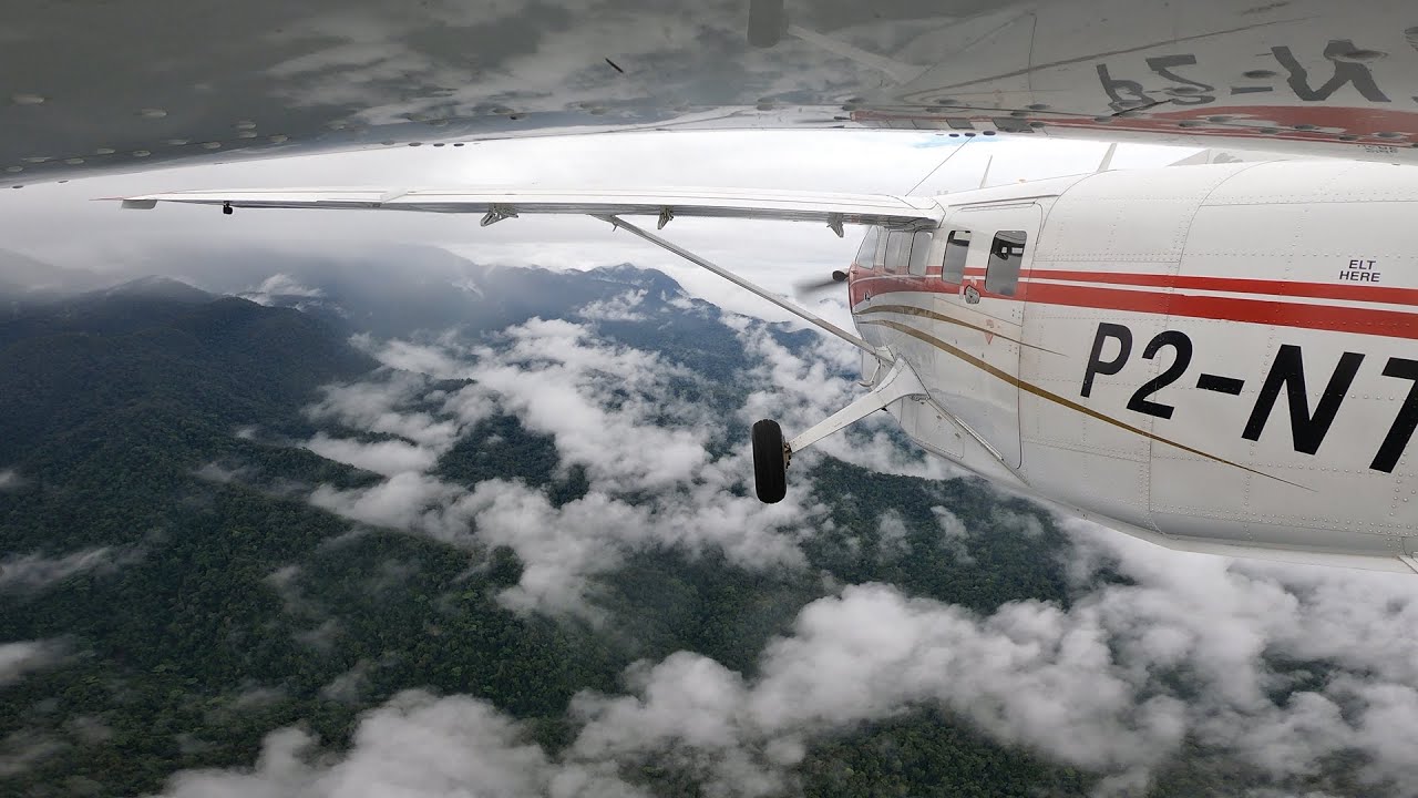 Timelapse Over Cloudy Mountain Peaks to Mountain Top Runway