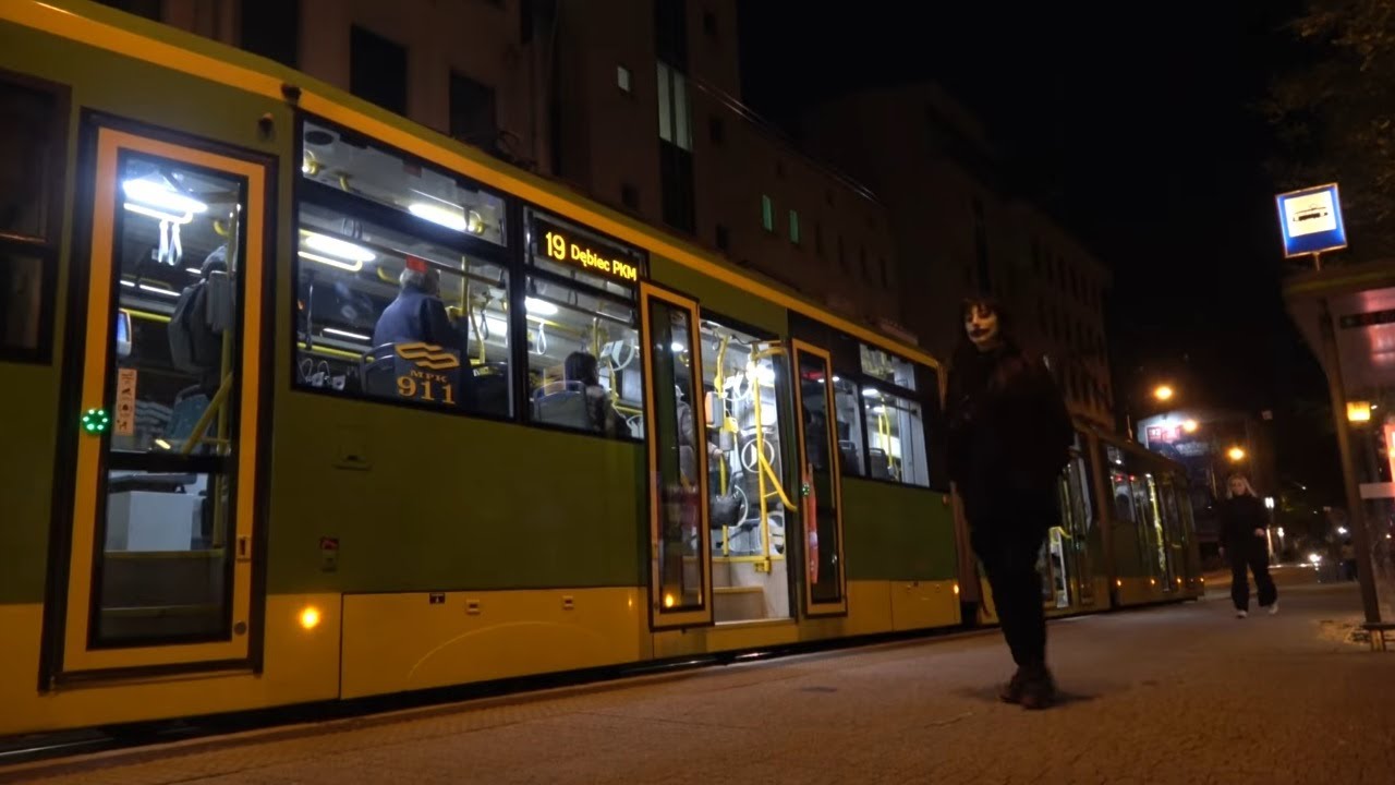 Poznań, Poland by night - trams, traffic.  Plac Wiosny Ludów & surroundings.