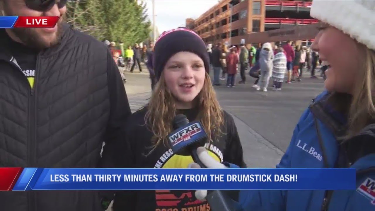 WFXR's Kathlynn Stone talks to a family as they get ready to run the Drumstick Dash