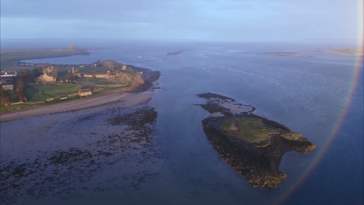 Rainbow at dusk over holy island of lindisfarne, dgi 4 mini pro