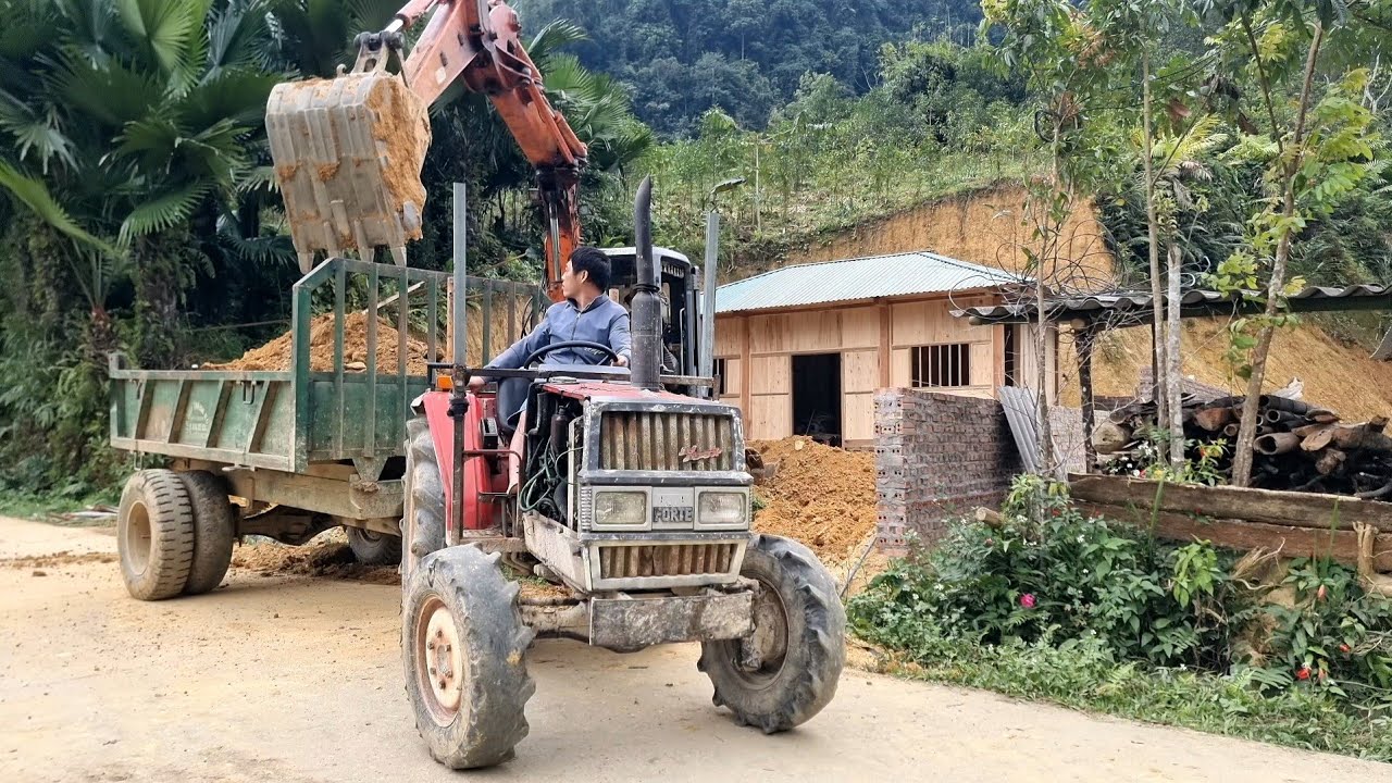 Complete the water tank and level the yard using an excavator.