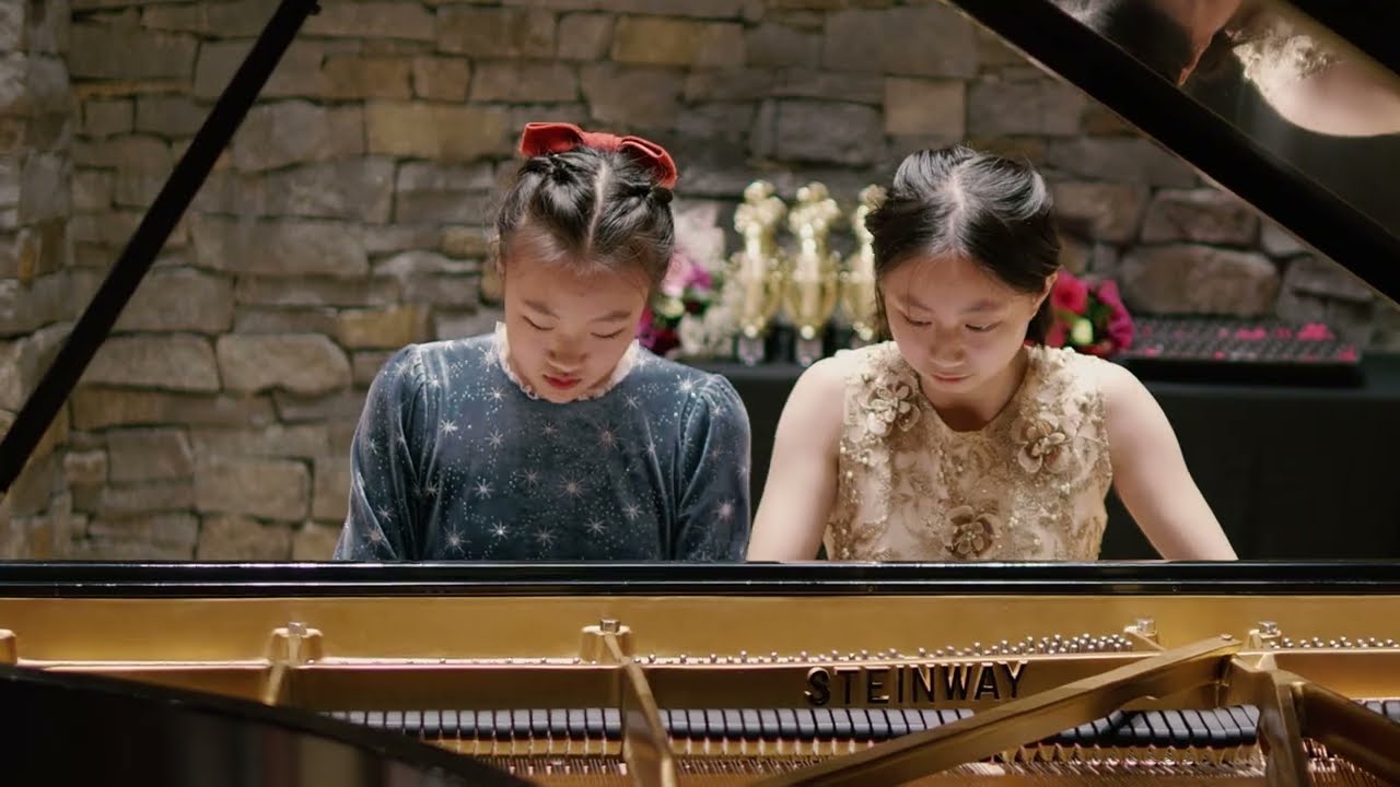 Tiffany and Emma play piano duet Rhapsody Grandioso by Melody Bober