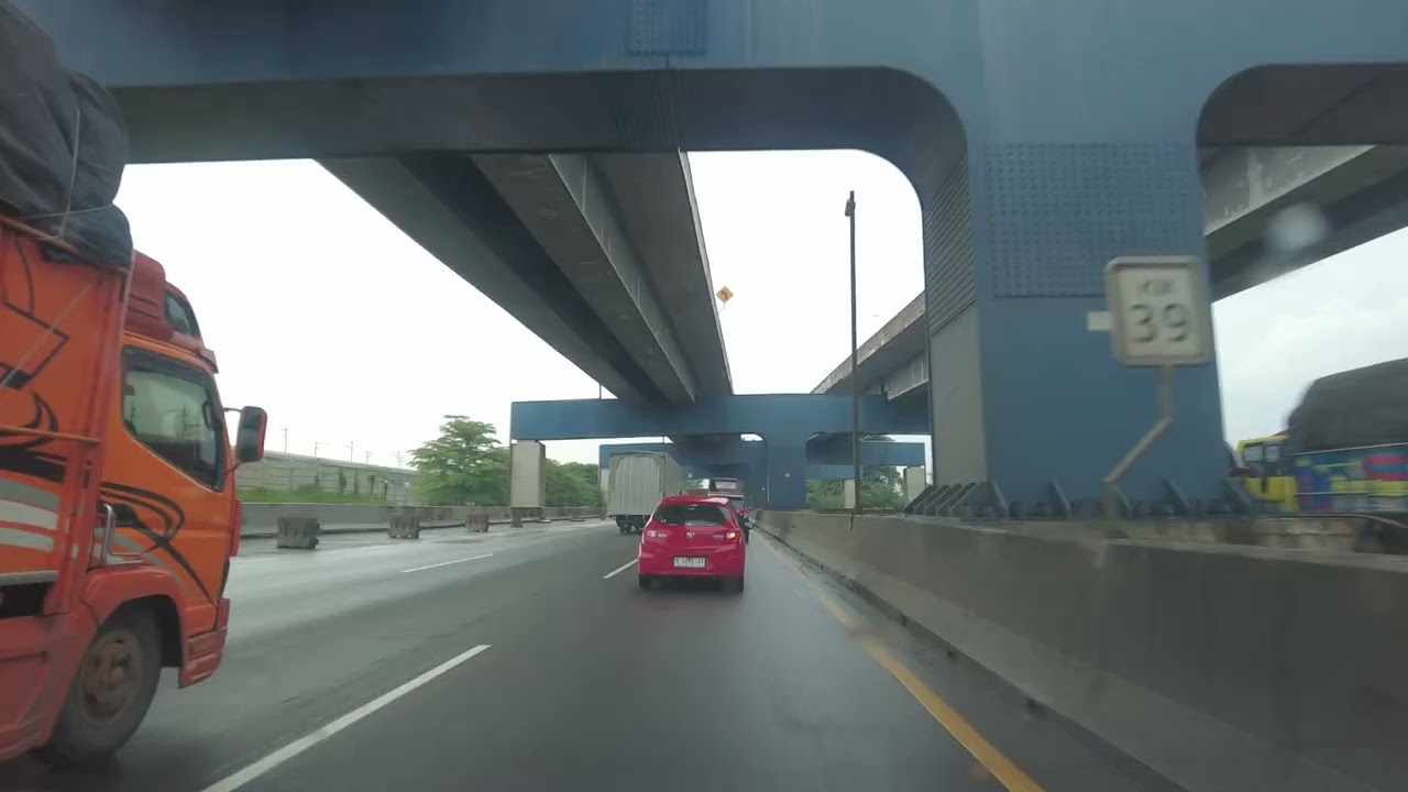 Driving on Jakarta-Cikampek Toll Road From Karawang Barat to Cibitung Under Overcast Skies