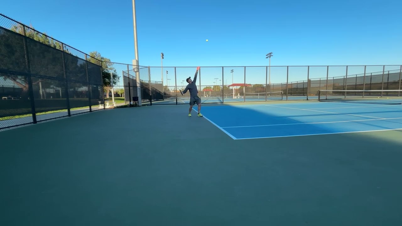 Tennis Serve - tucked elbow & contact in front