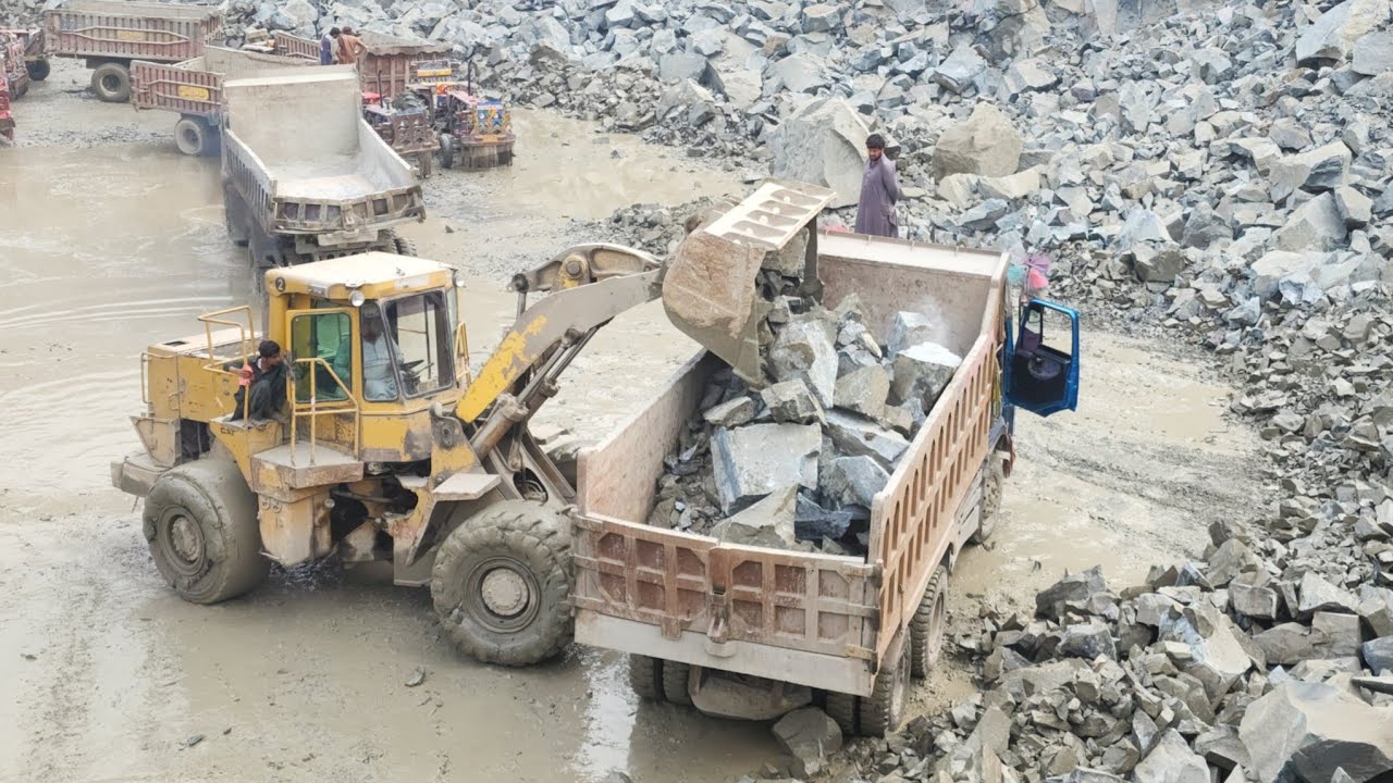 Massive Caterpillar 966D Power Loading: Extreme Mountain Mining & Rock Transport
