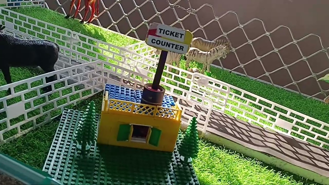 Zoo shave animals , trees and water 