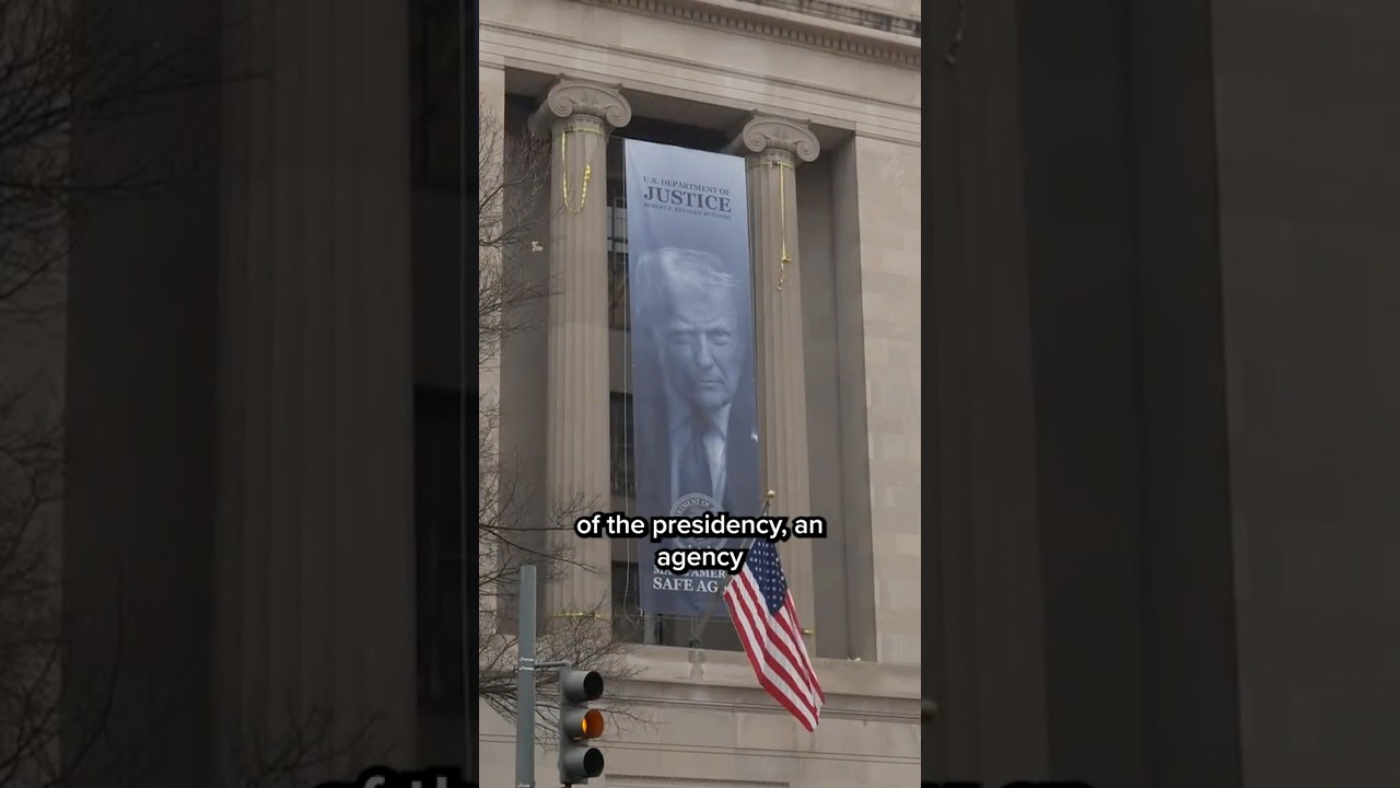 'Donald Trump is watching you': New banner looms at Trump Justice Department