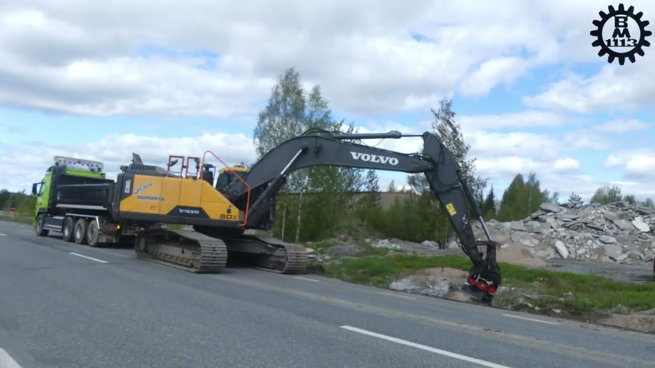 Volvo EC300EL ditching a road with a Rototilt and gradingbucket