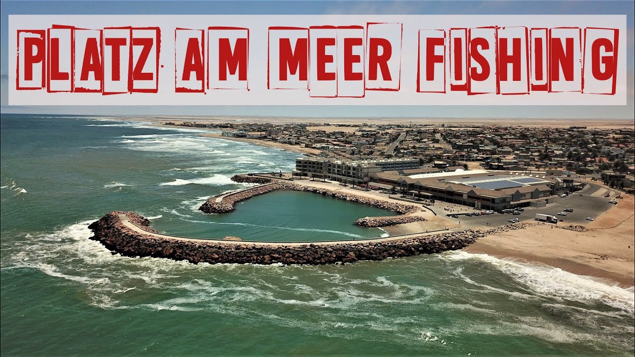 FISHING CATFISH IN PLATZ AM MEER BREAKWATER JETTY IN SWAKOPMUND, WEST COAST OF NAMIBIA