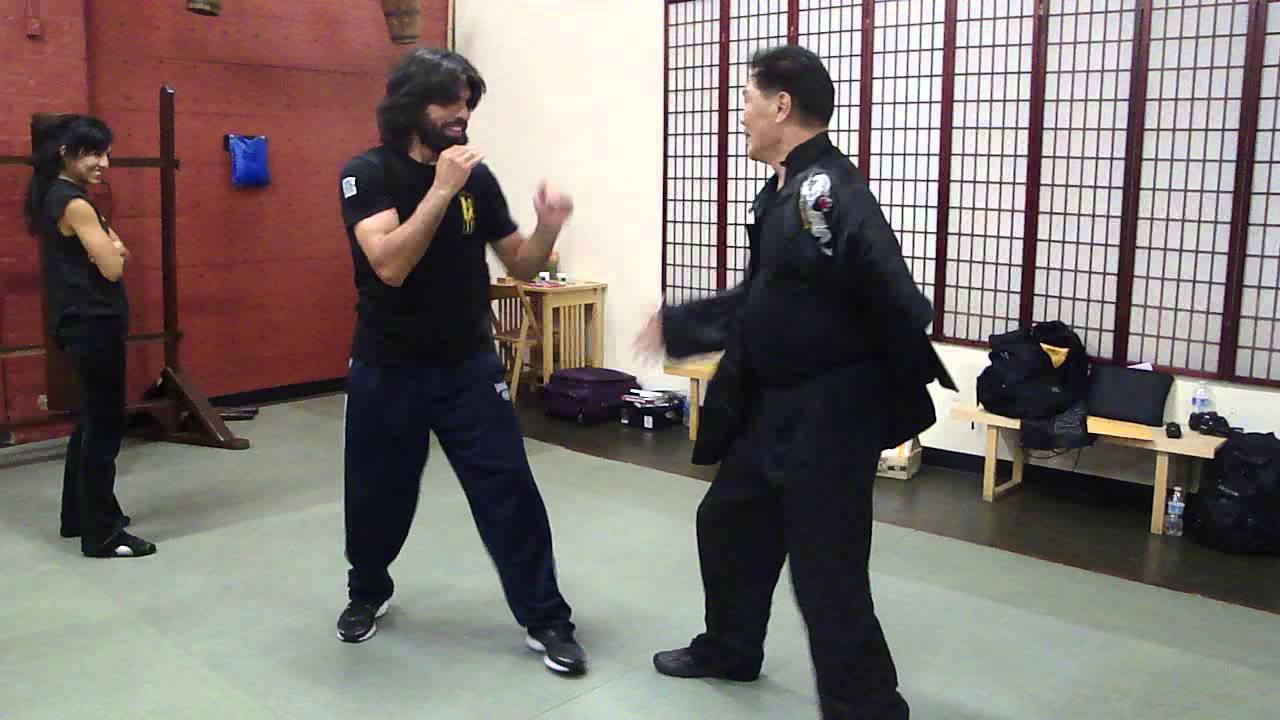 72 year old Sifu William Cheung using one arm with Boxer Alfredo Angulo.