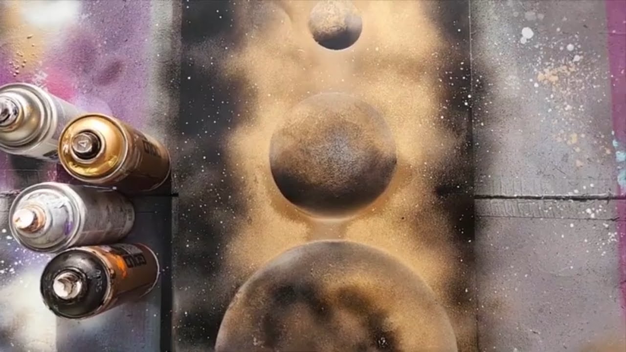 Black and gold spray paint planets