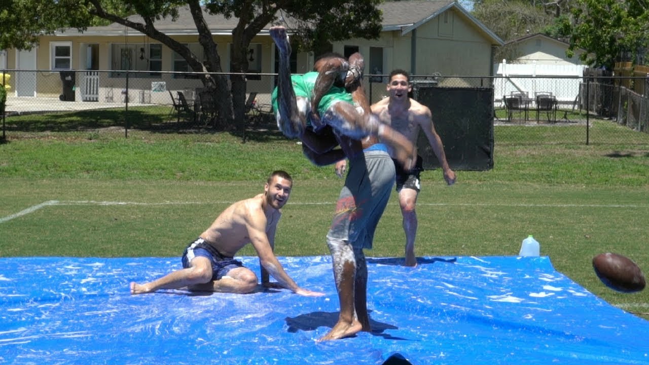 WE PLAYED A GAME OF FOOTBALL ON A SLIP AND SLIDE