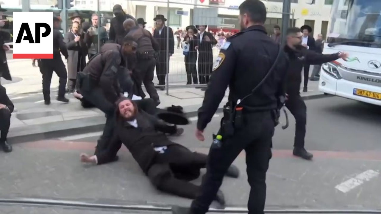 Jerusalem police drag ultra-Orthodox Jewish men protesting military enlistment