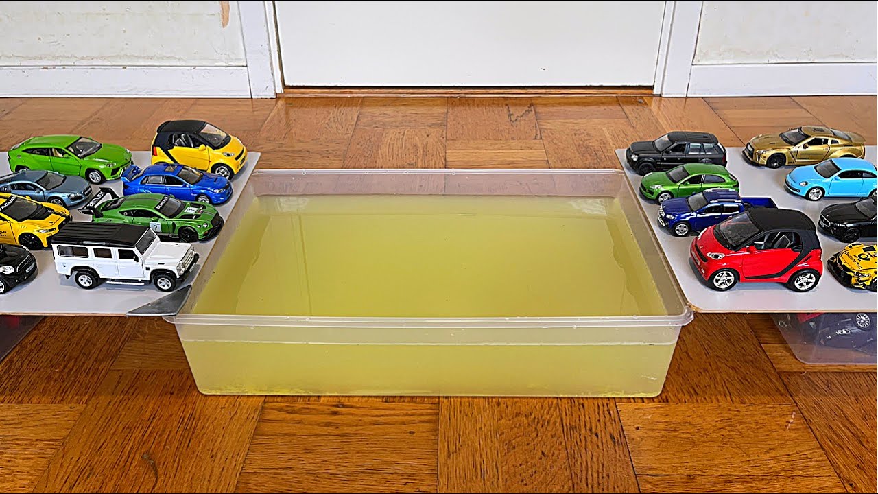 Diecast Cars Sliding Into The Yellow Water