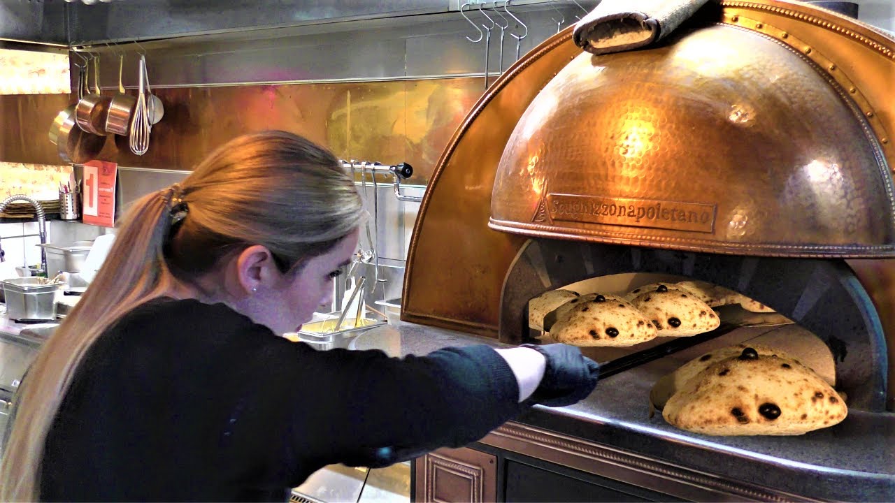 Cooking and Eating Italian Panuozzo from Naples. Street Food in Warsaw, Poland