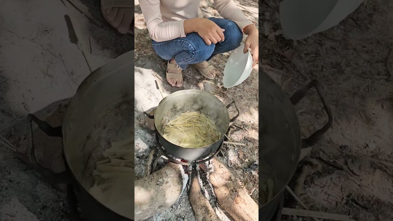 Lao girl is boiling the young shoots of a broom tree to make curry. #dreamnature #nature #food #laos