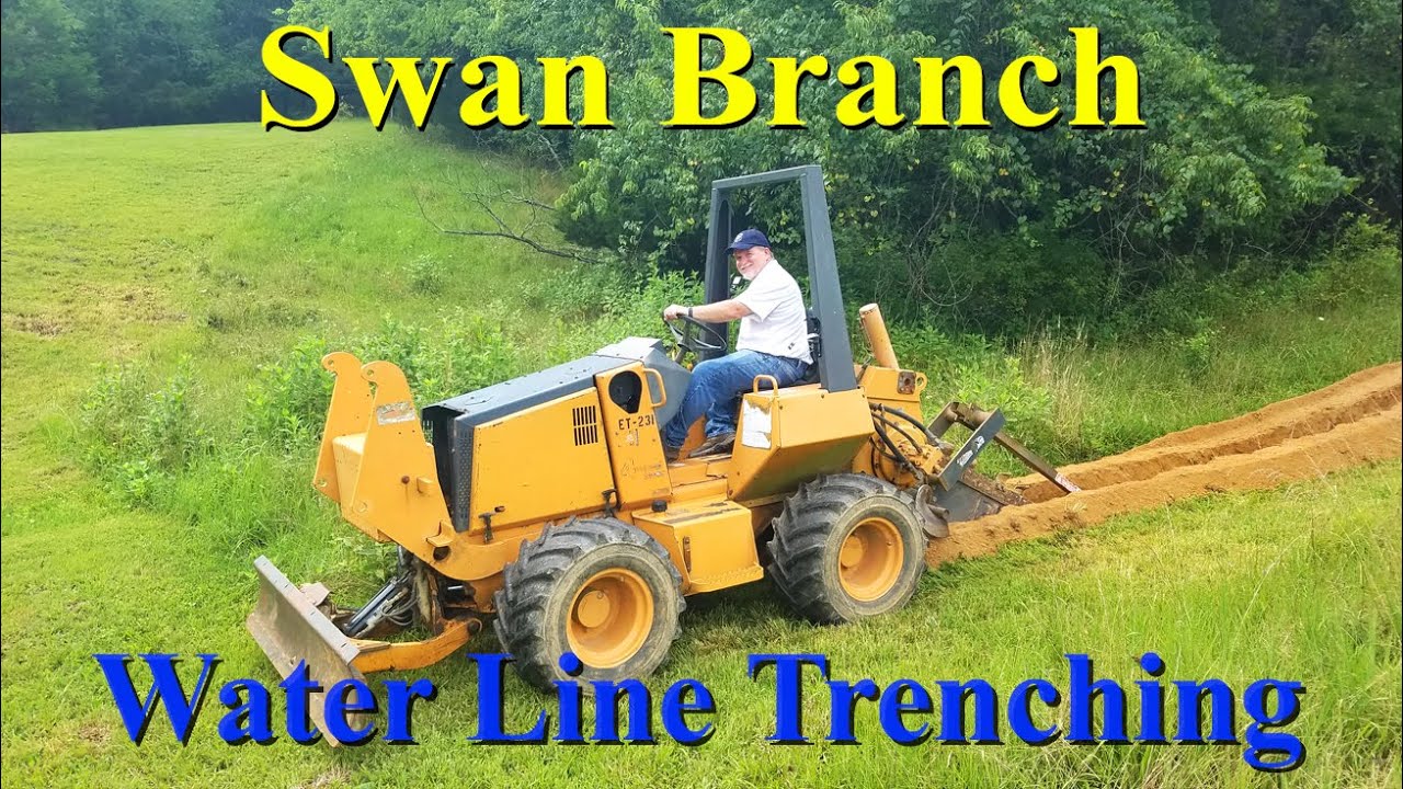 Digging a trench to bury black poly pipe water line from our well