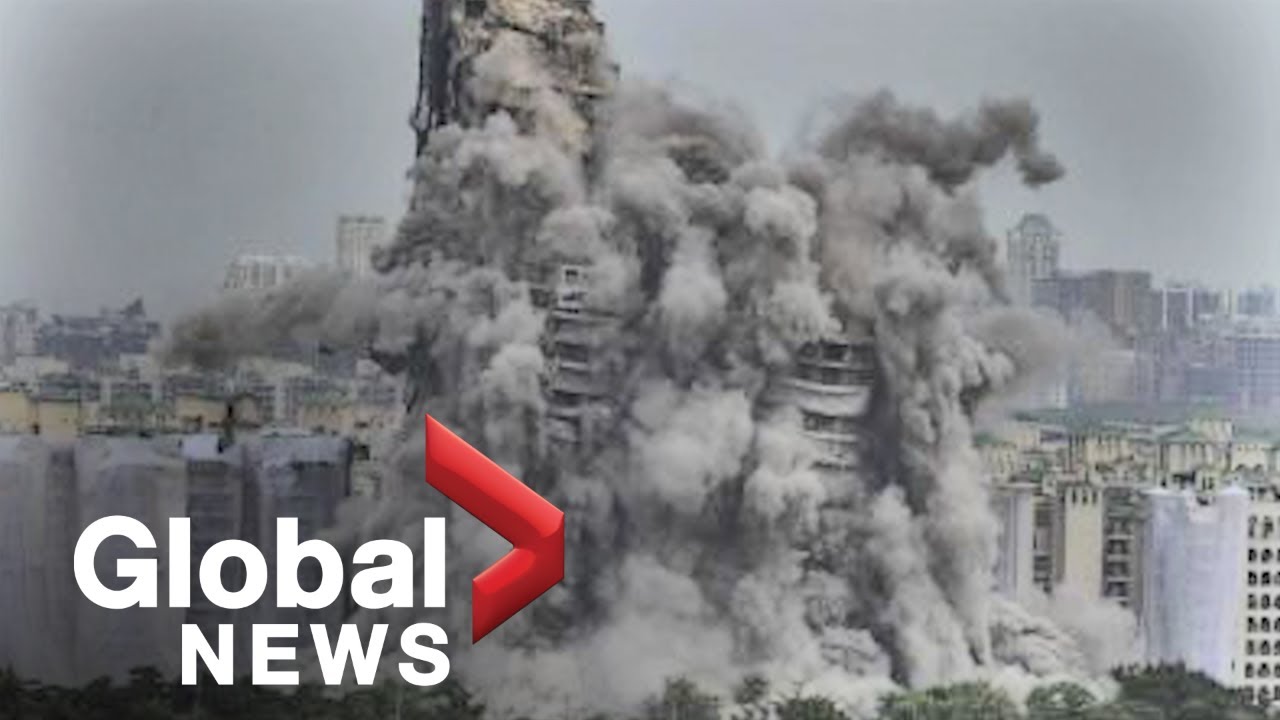 India demolishes skyscrapers that violate building laws sending plumes of black smoke into air