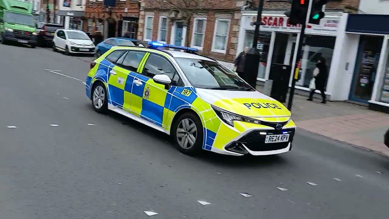 Wiltshire police response car responding to an incident on Royal Wotton Bassett High Street 