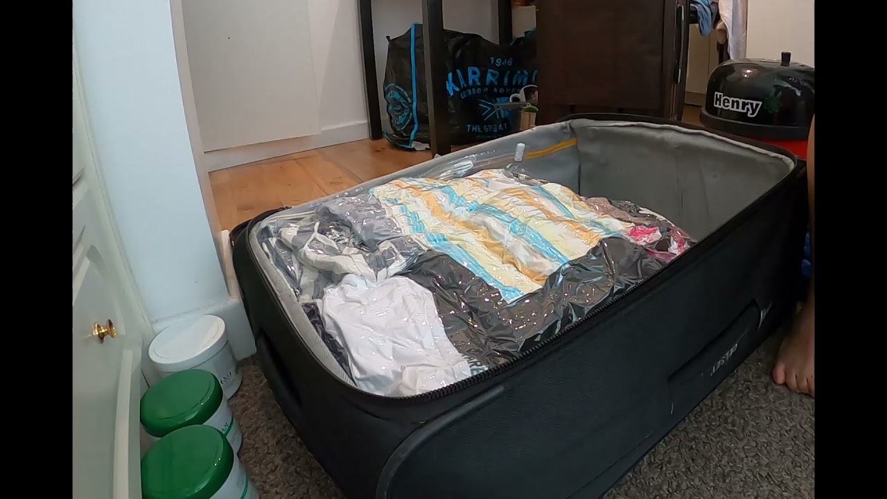 Packing Clothes in Vacuum Bags (timelapse)