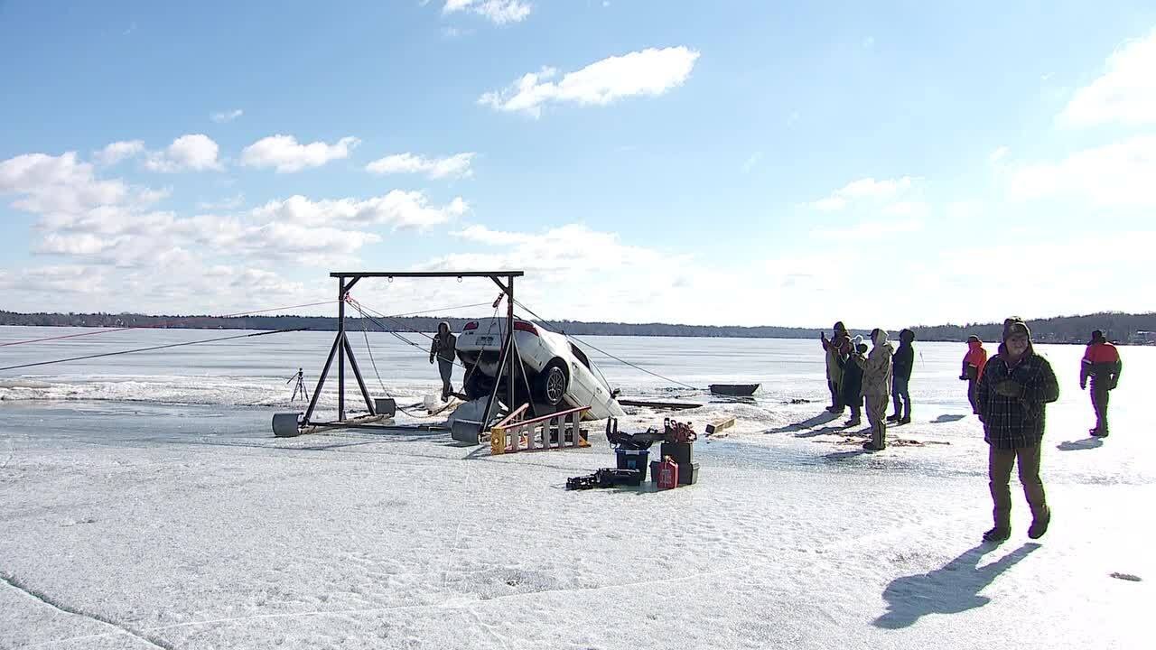Buick stuck in ice on White Bear Lake removed