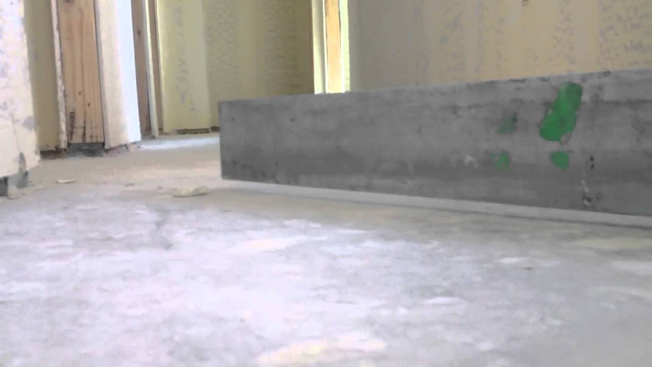 Checking a concrete floor for tolerance.