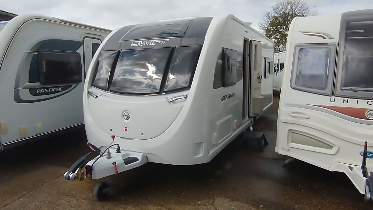 Swift Fairway 560 rear island bed mid bathroom.  As new condition inside and out.  2020 model year.