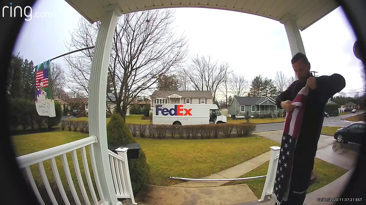 FedEx driver folds fallen flag