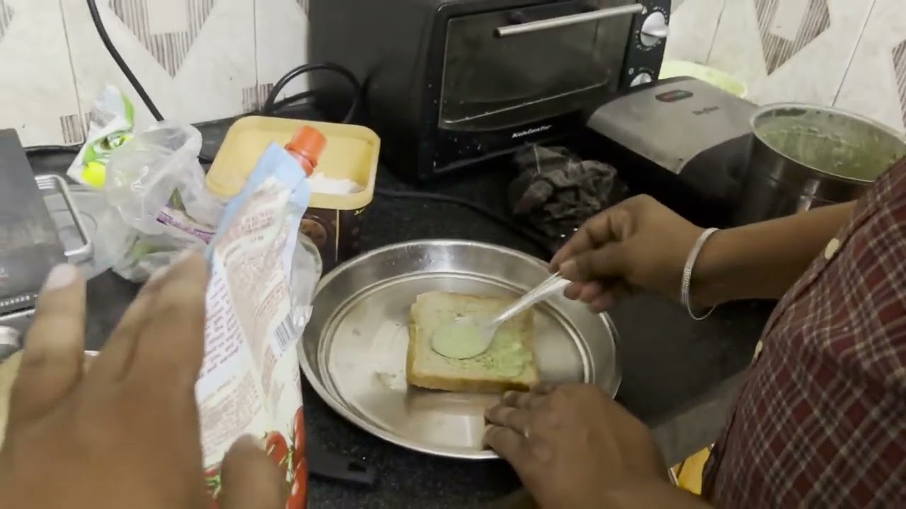 Making and eating of grilled sandwich with aloo tikki and iced coffee 