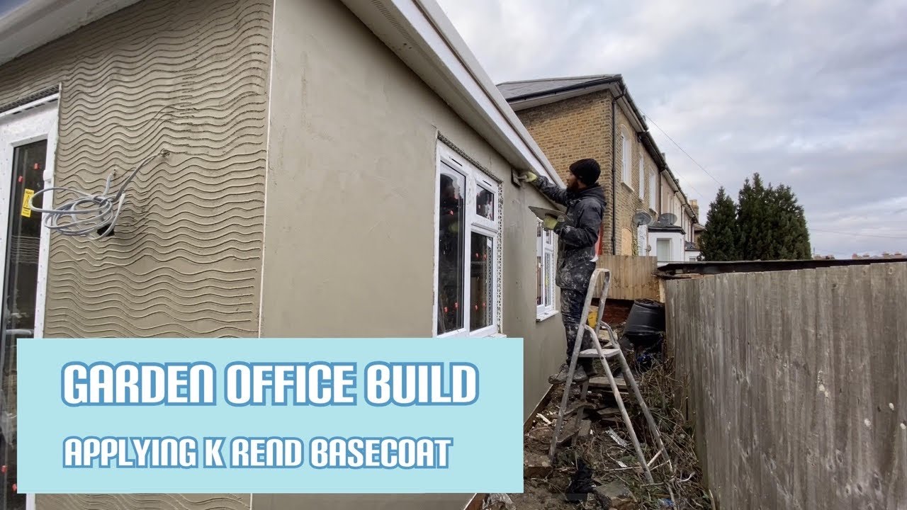 Applying K Rend base coat to the garden office