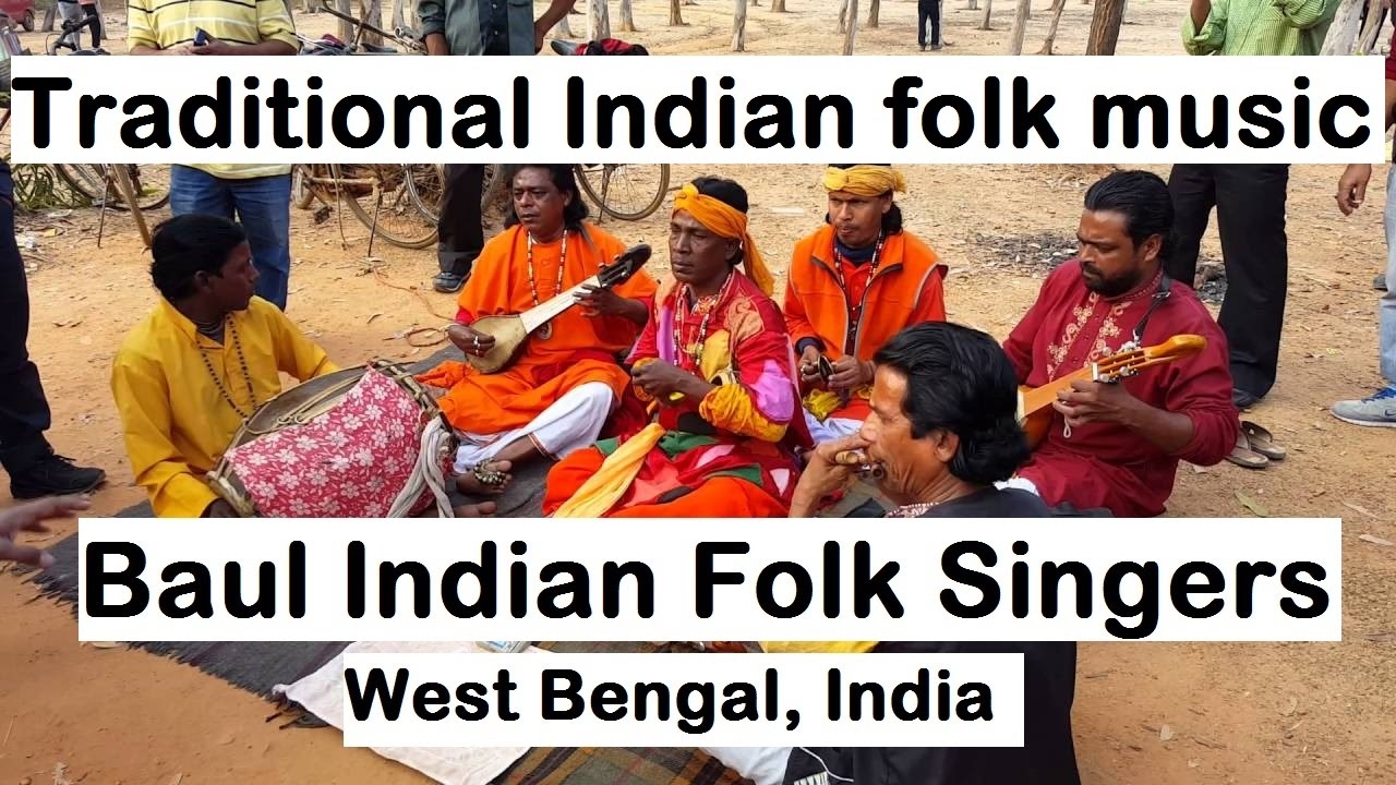 Baul Indian folk singers with traditional bengali clothes and musical instruments