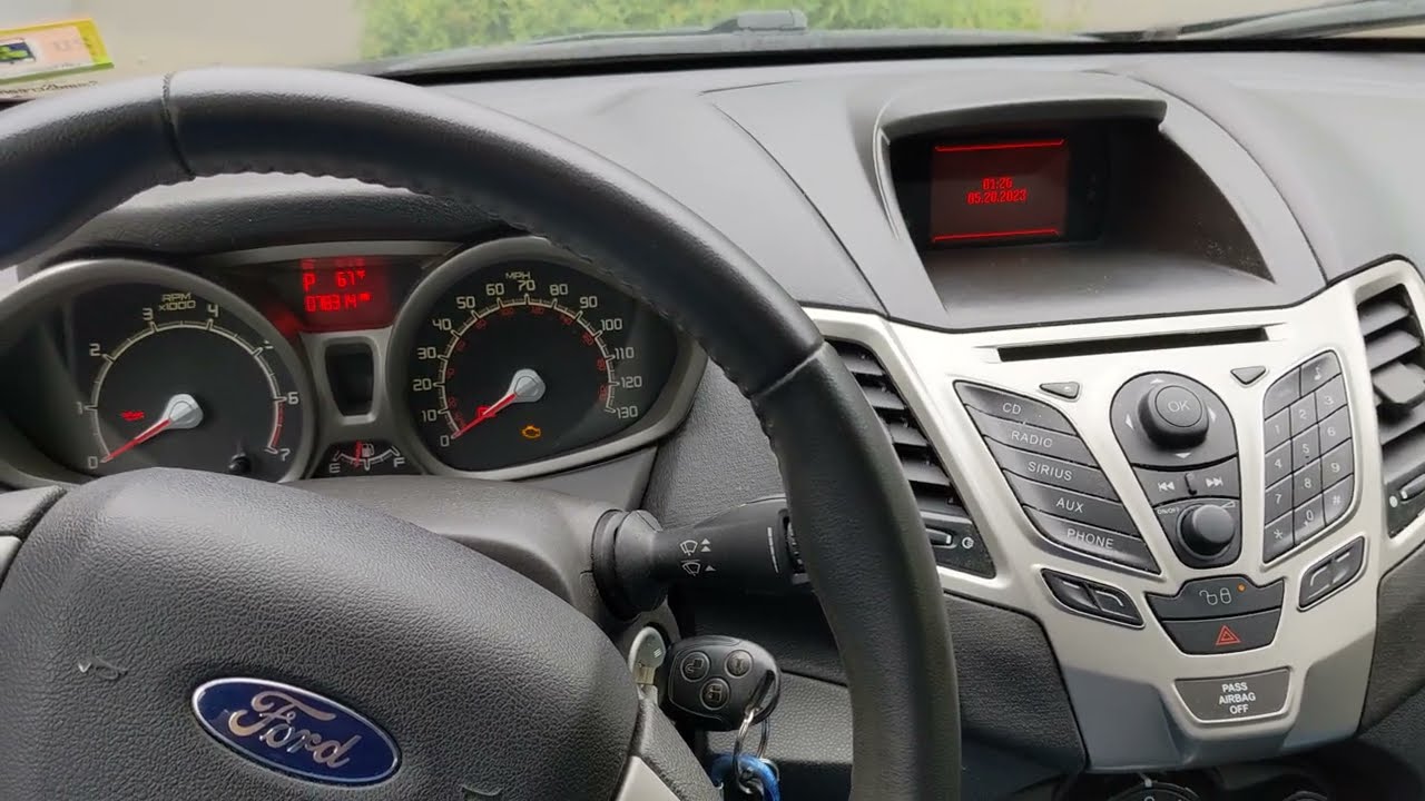 How to set the clock in a 2011 Ford Fiesta (dashboard center console display date and time)