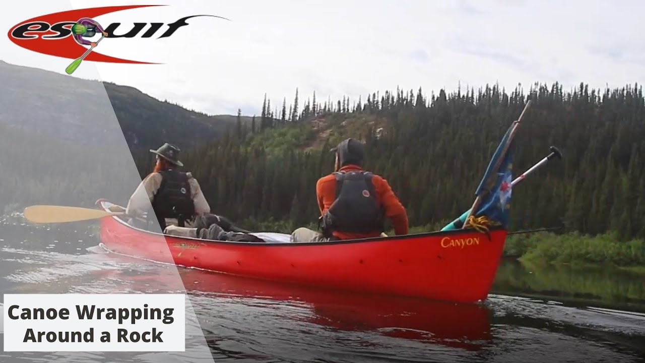Canoe wrapping around a rock