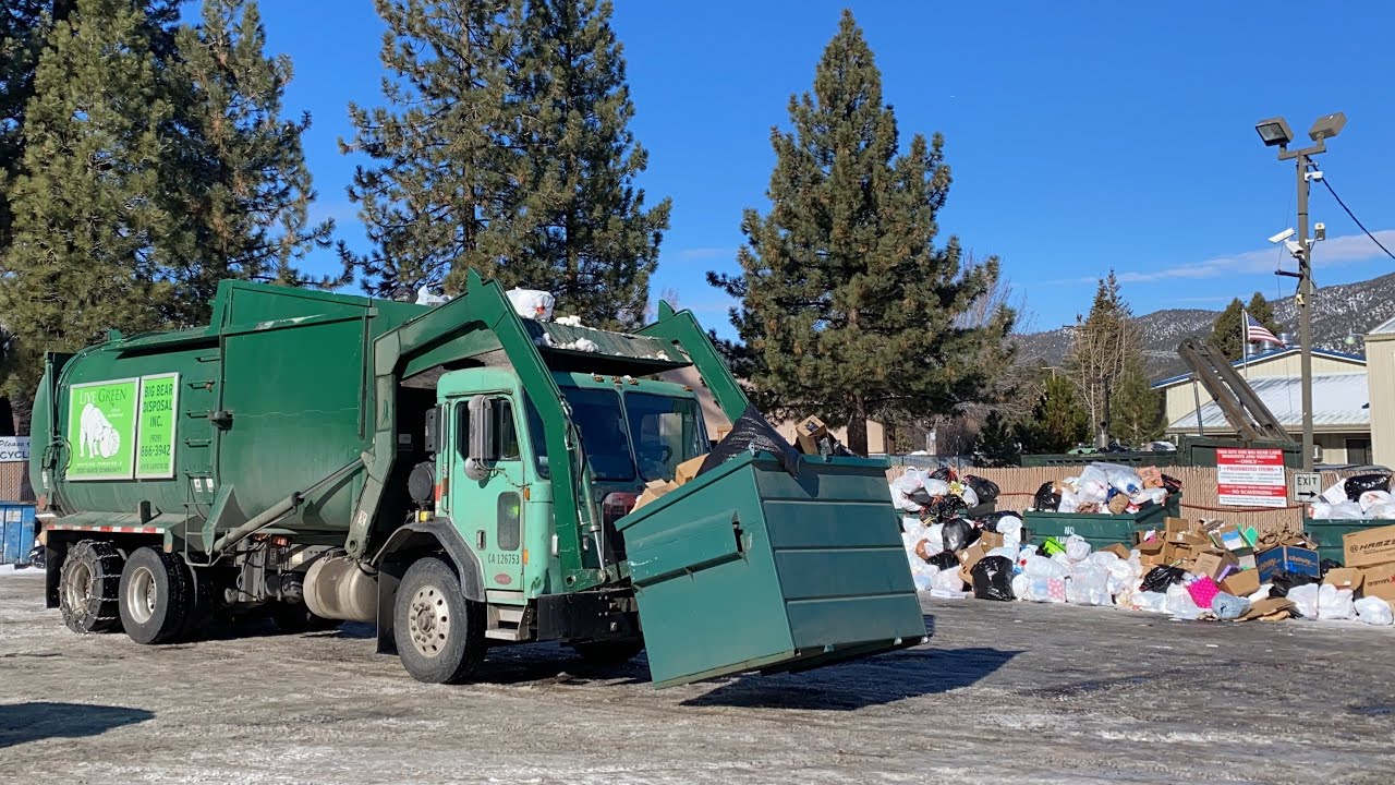 Big Bear Front Loader on Overfilled Dumpsters and Massive Trash Piles