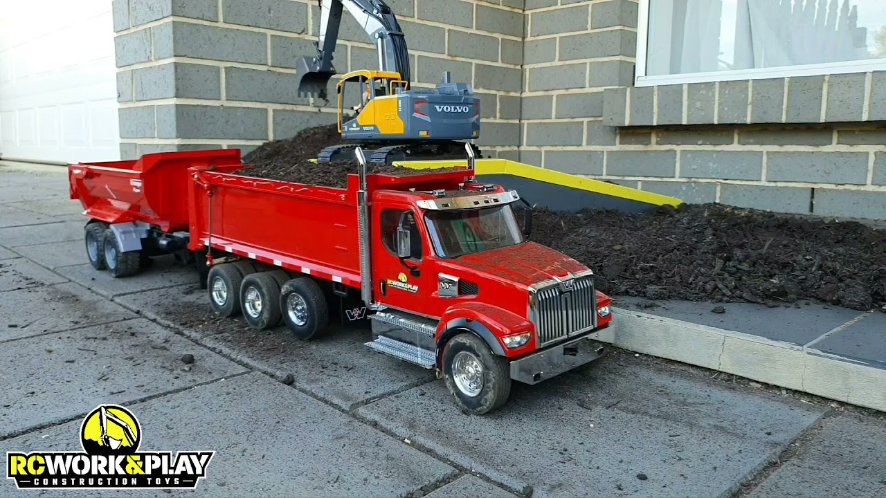 RC Volvo EC160E metal screw drive excavator loading RC Western Star 49X dump truck & Krampe trailer
