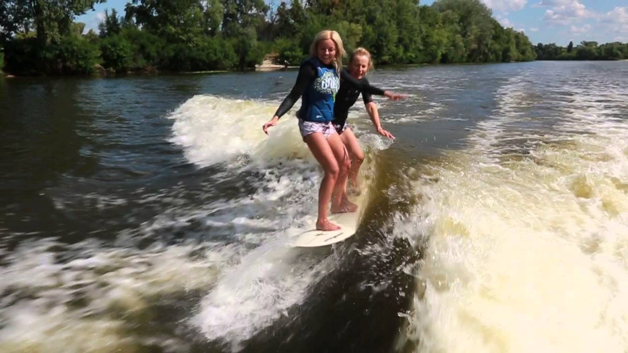 Two blondes wakesurfing