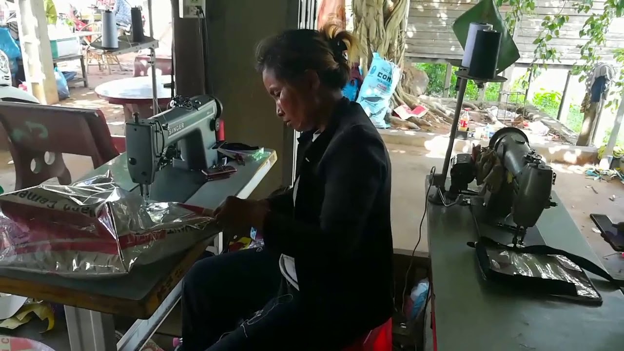 Woman recycle . Making cement bags