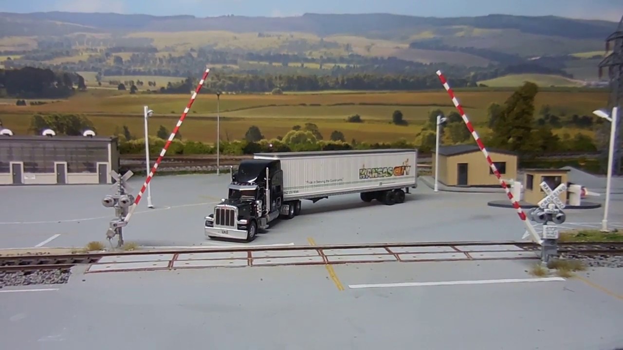 Operating Crossing Gates Controlled by Logic Rail Pro Controller. Infrared Sensors