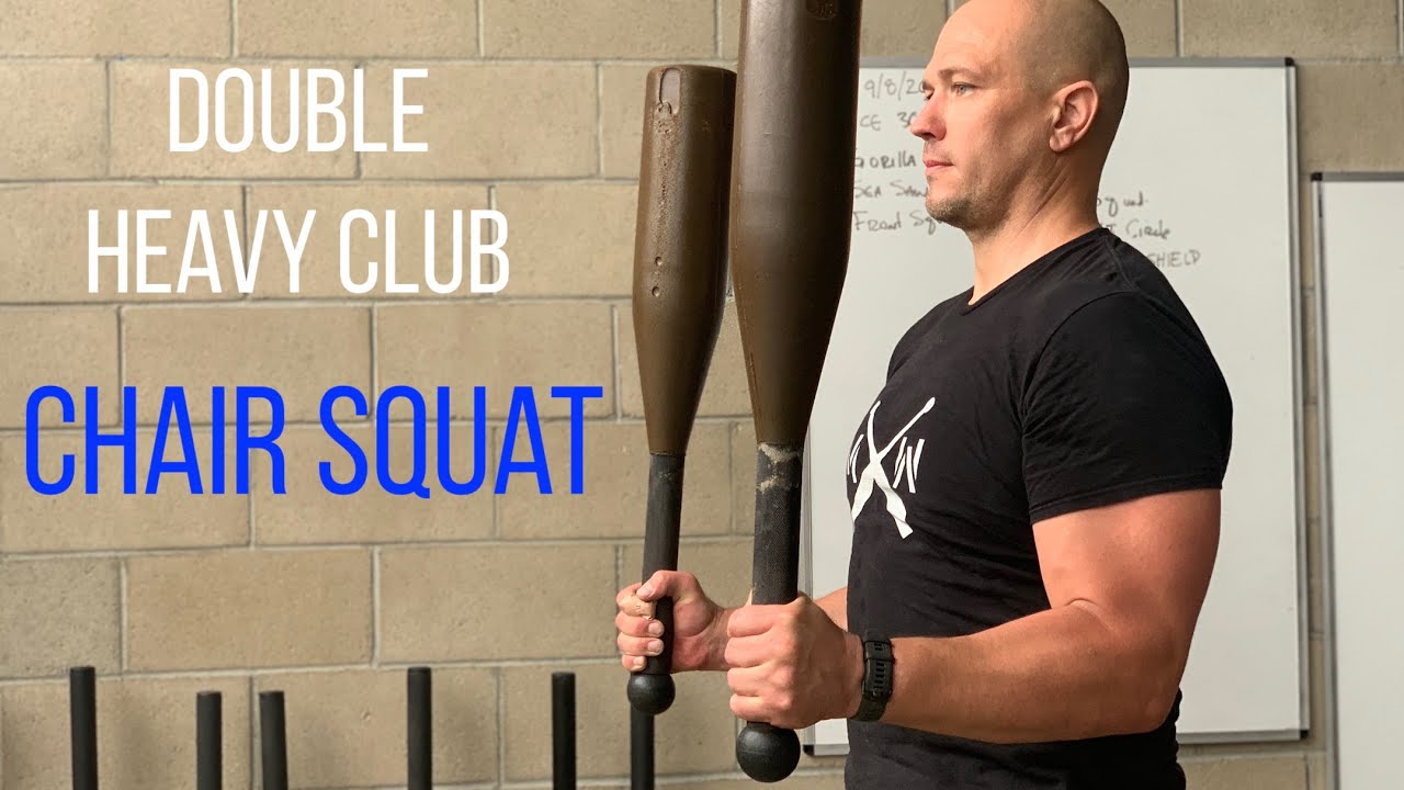 Double Heavy Club Chair pose Squat - an Abs and Arms connection exercise.
