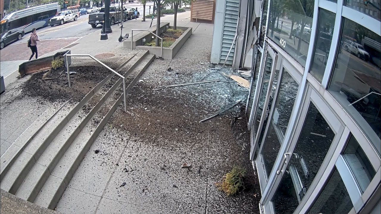 Out-Of-Control Tesla Crashes Through Convention Center Wall
