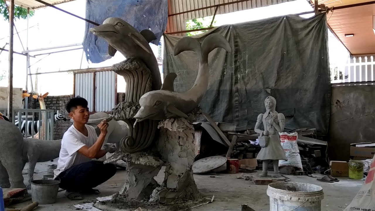 Design technique for garden dolphin statue with construction cement materials