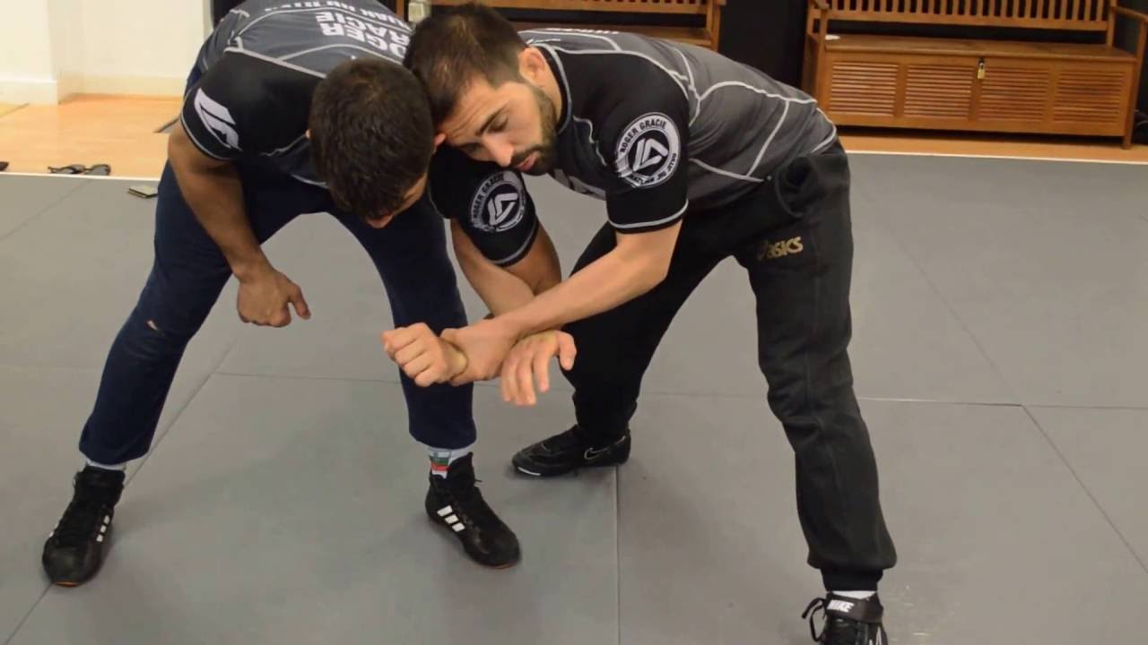Two on One hand control lock ( draging the opponent down or double takedown)