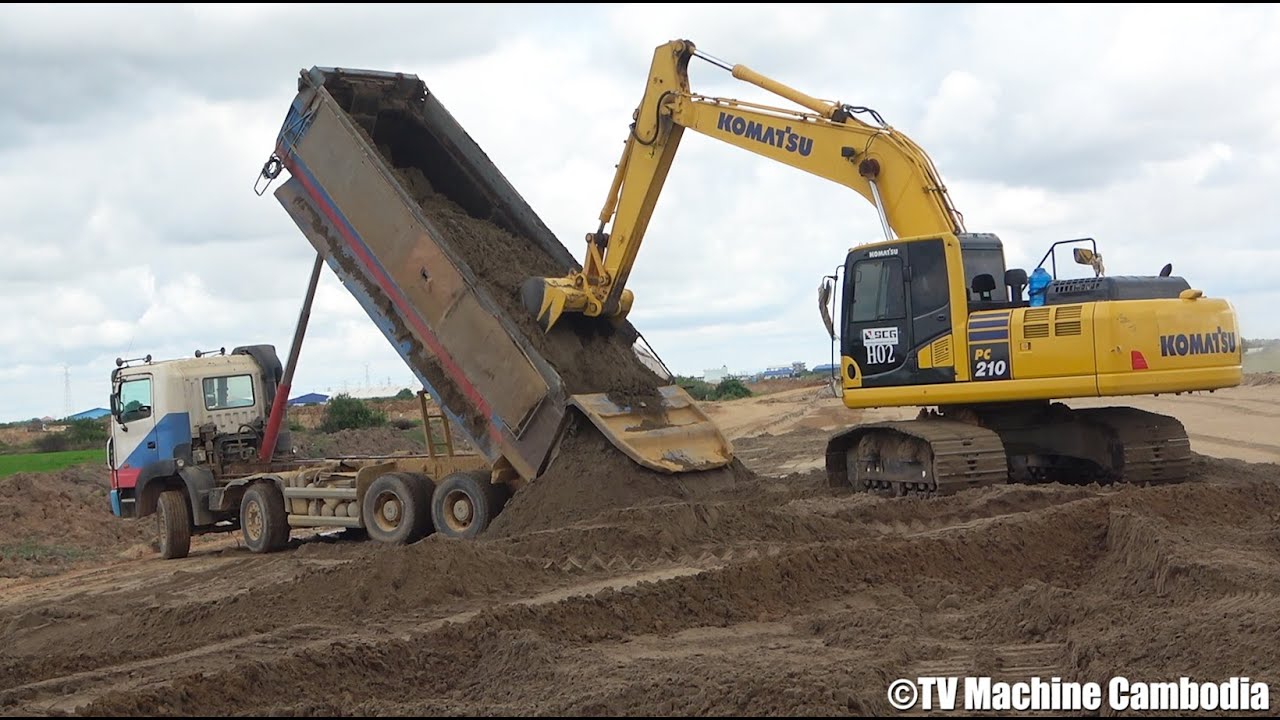 Komatsu Excavator digging sand, Dump Truck Working On Road, Dozer Pushing Sand