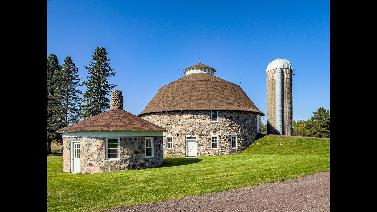 #LuxuryNorthwoodsEstate | Historic 1916 Round Barn + 1,300’ Montreal River Ftg | WI Dream Property