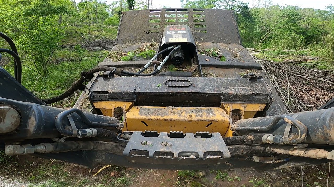 Mowing brush with the 333G Deere skid steer CID brush hog